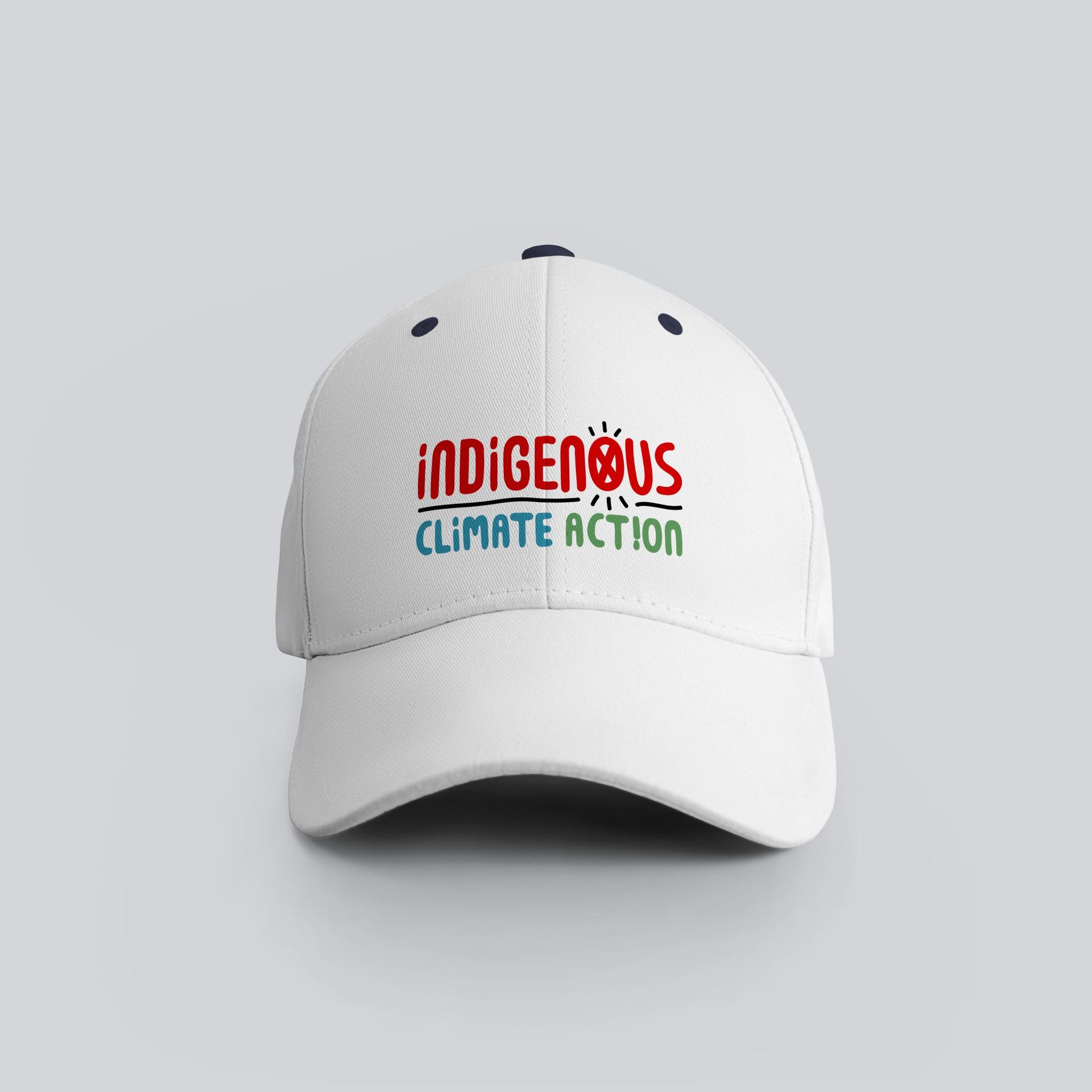 A white baseball cap that says indigenous climate action
