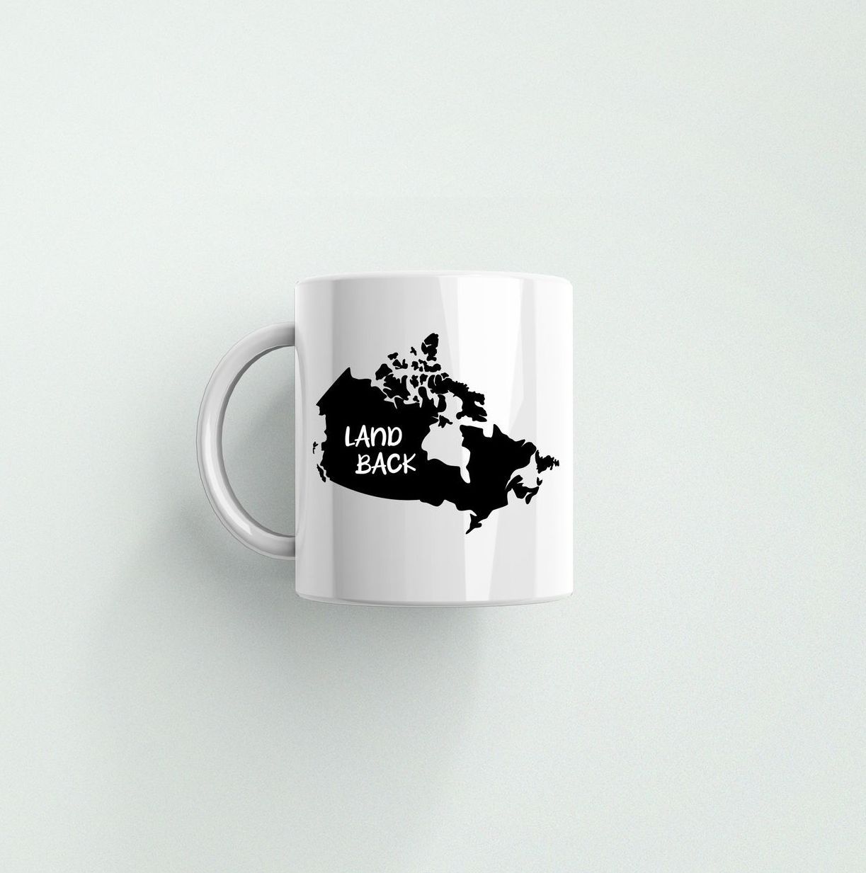 A white coffee mug with a map of canada on it