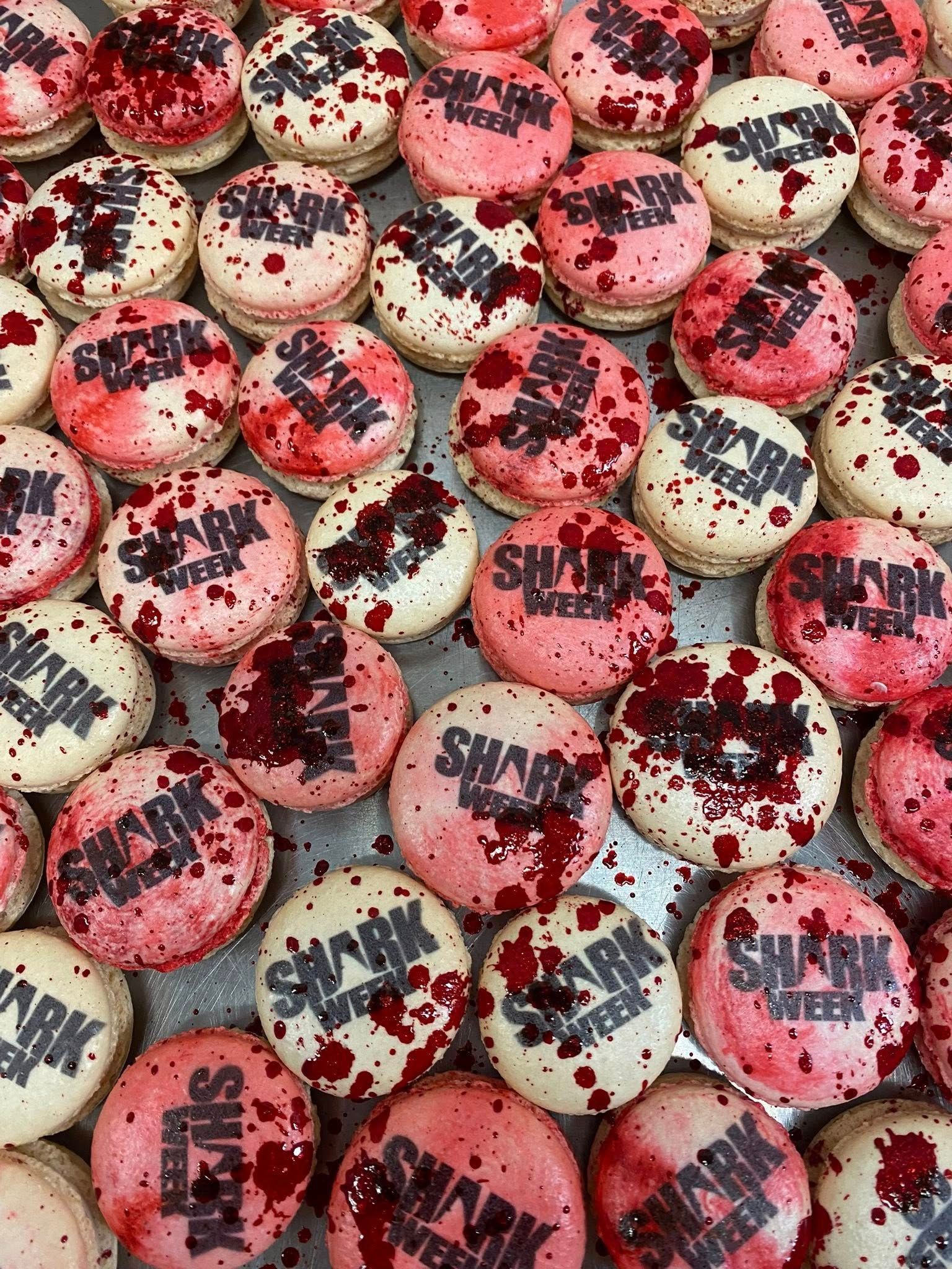 Shark Week macarons: white, pink, and red splattered with 