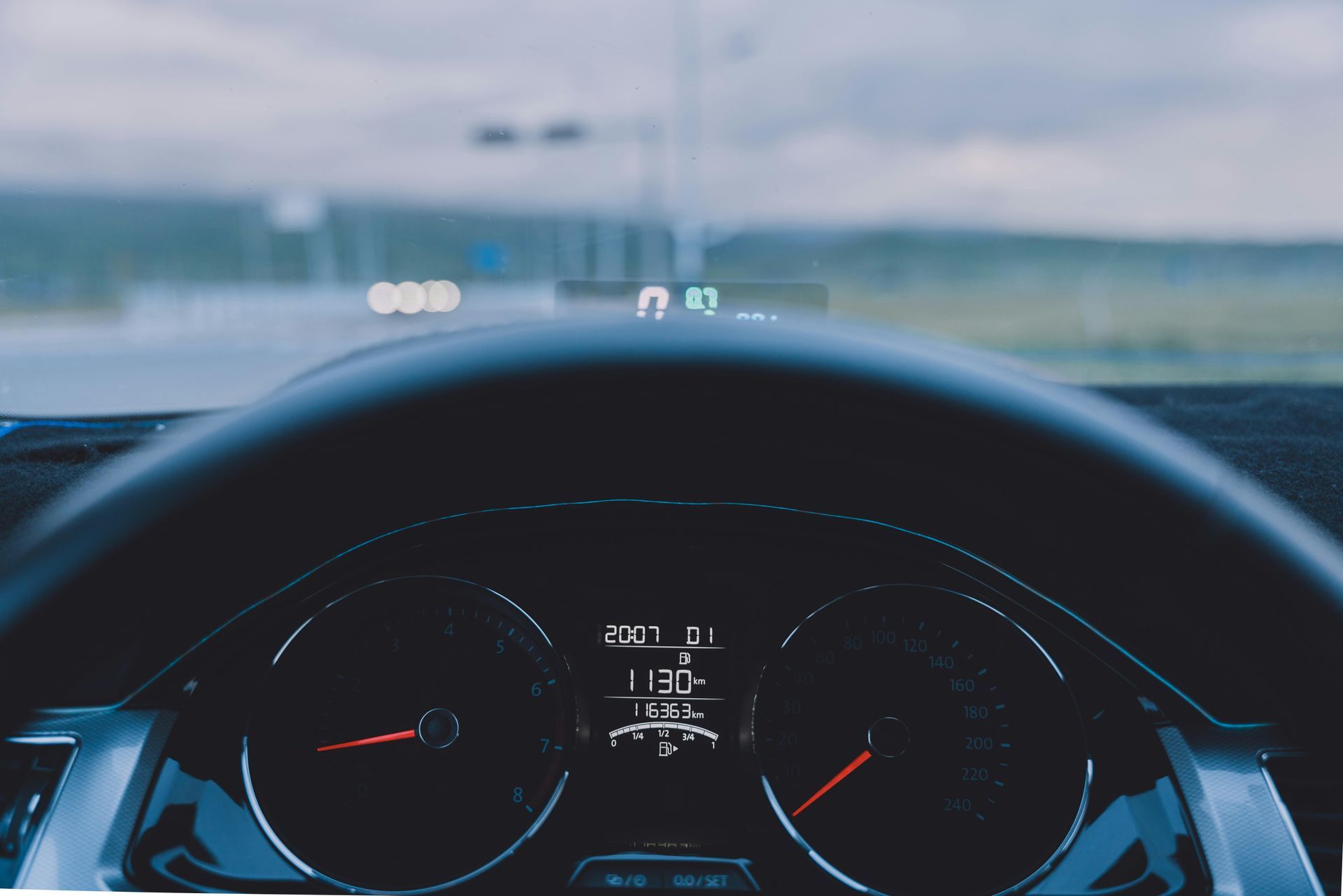 A close up of a car dashboard with a digital display that says 30