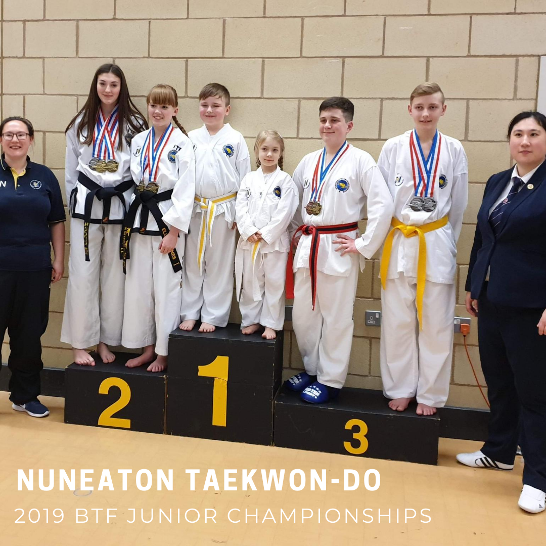 Taekwondo students on podium