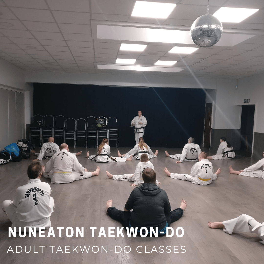 Taekwondo adults sitting stretching