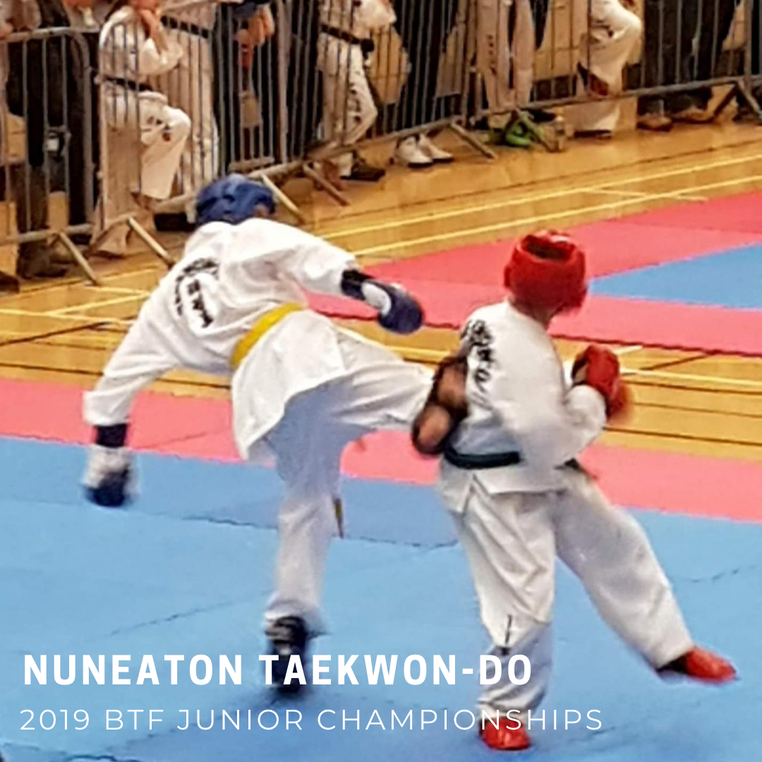 Taekwondo students sparring in tournament