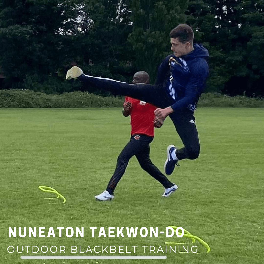 Young man jumping side kick