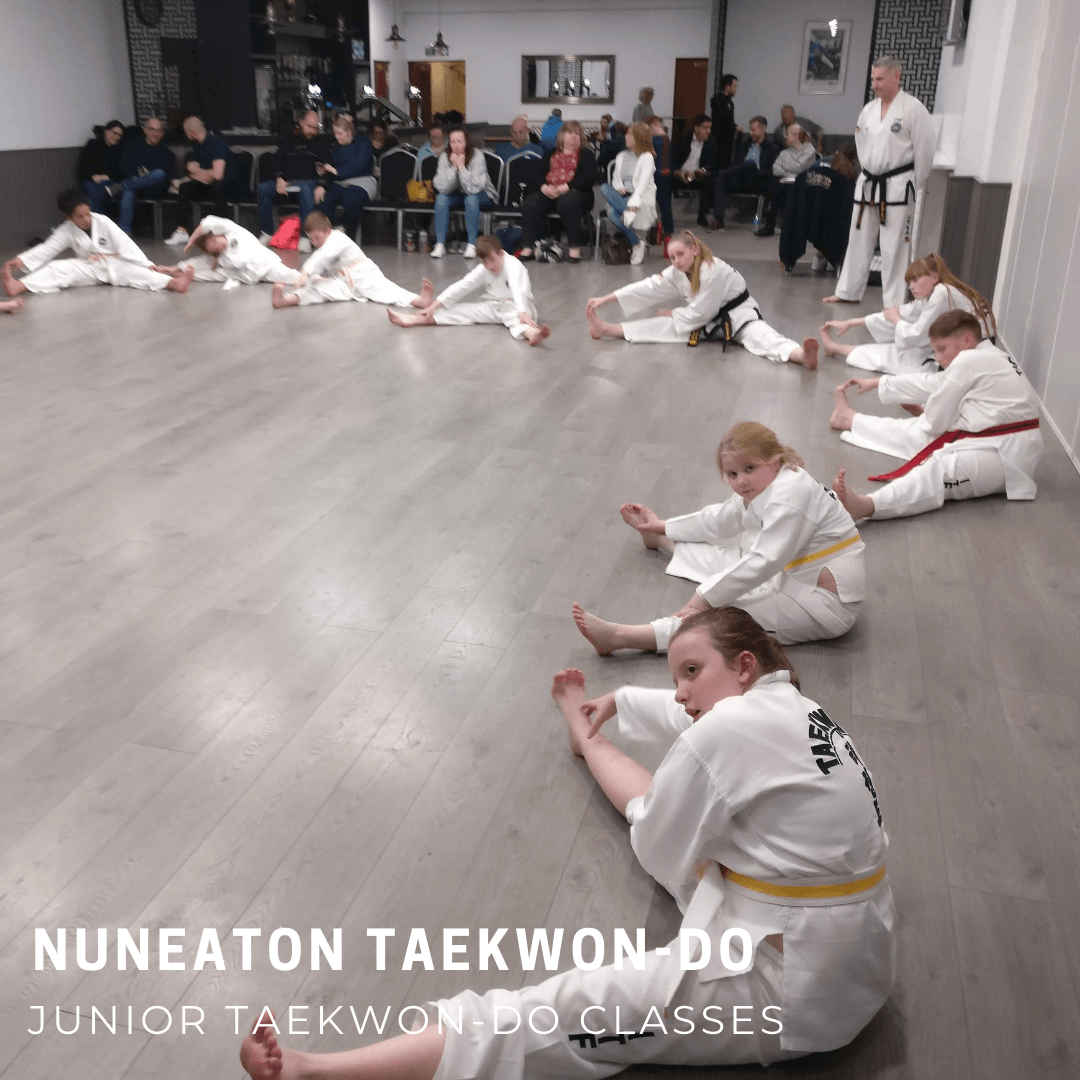 Martial Arts students stretching in class