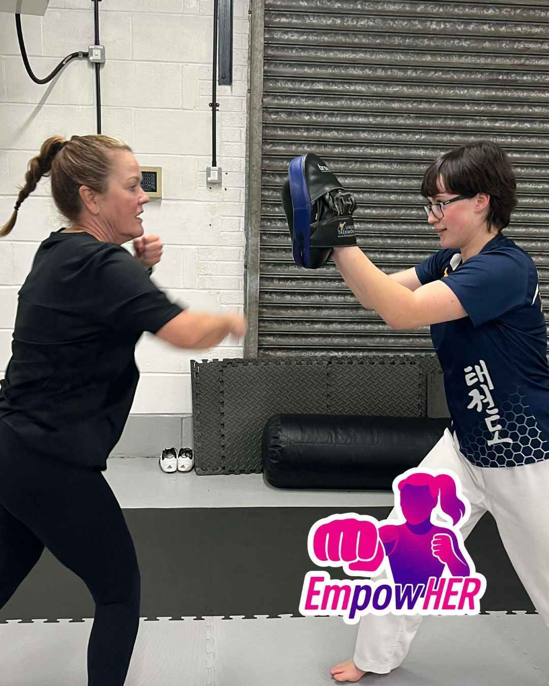 Nuneaton TKD Ladies EmpowHER course lady punching pad