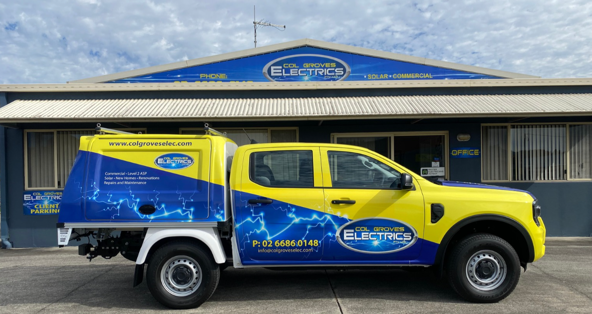 A yellow and blue service truck branded