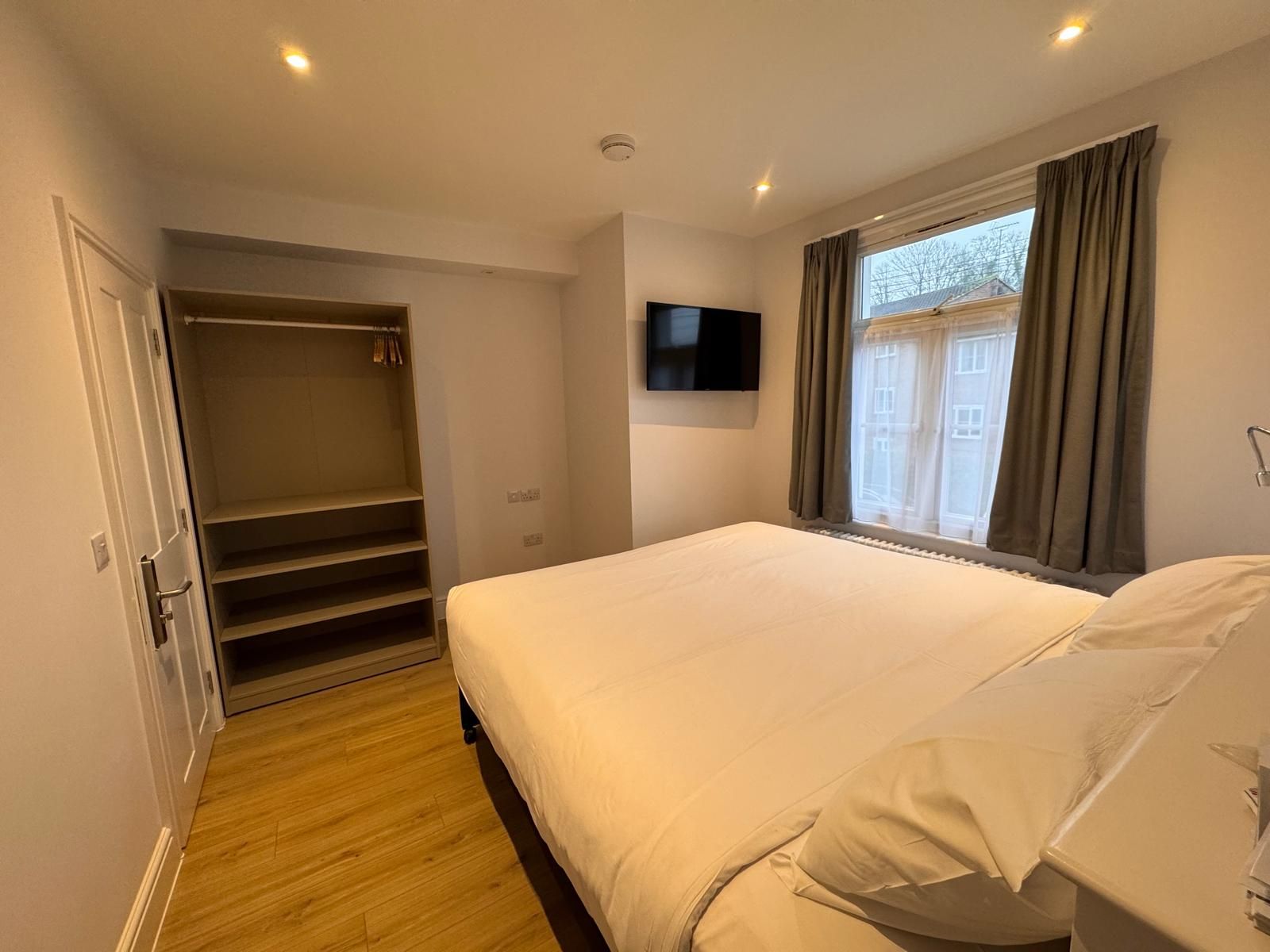 There is a large bed in the middle of the room.