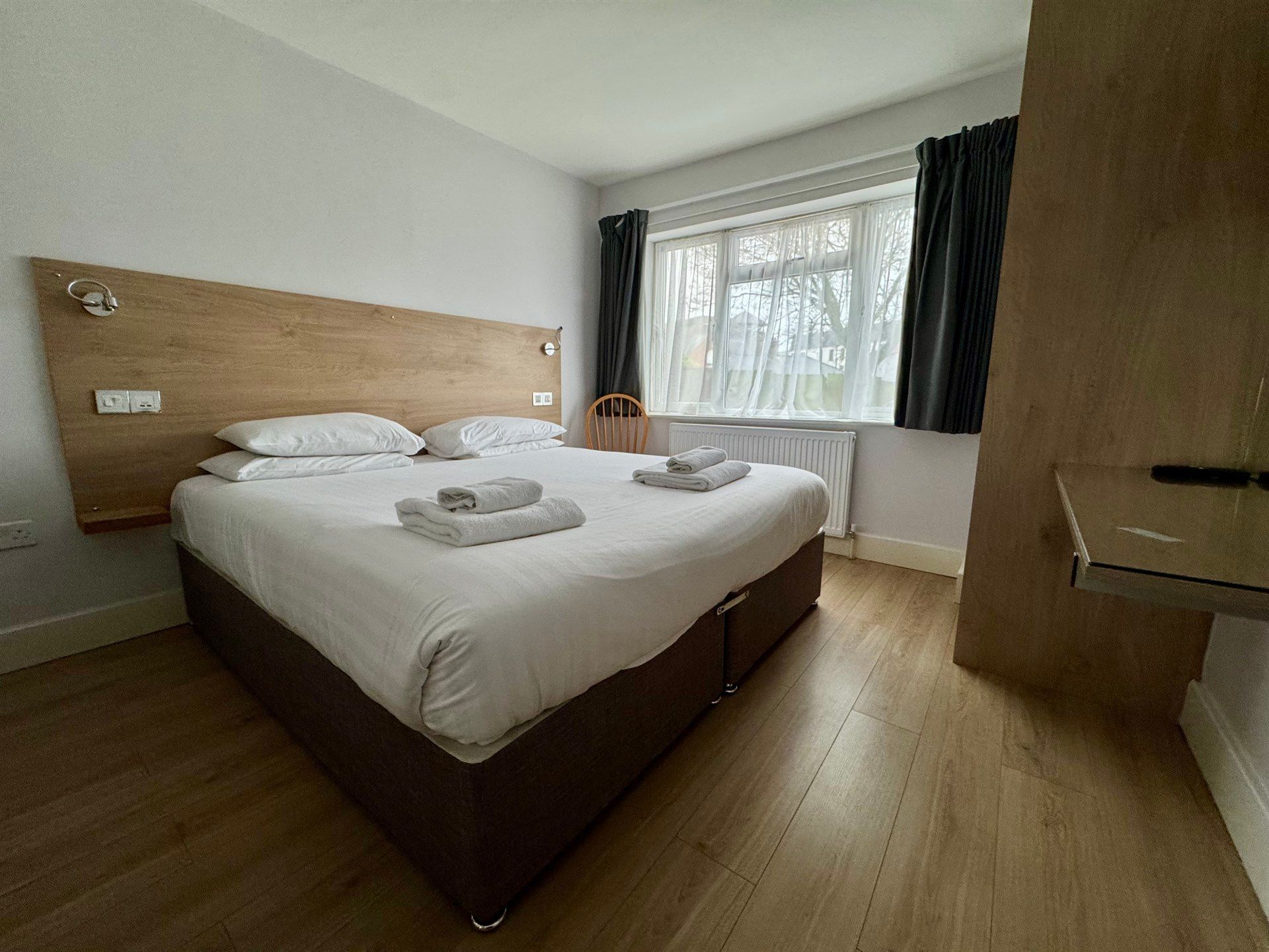 There is a large bed in the middle of the room.