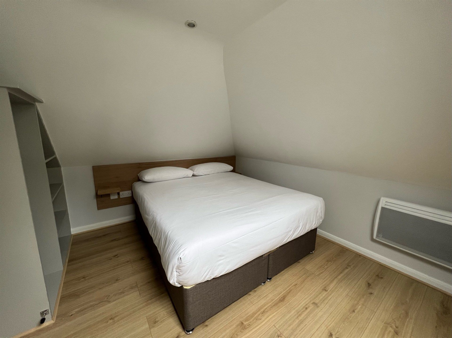 There is a bed in the middle of the room.