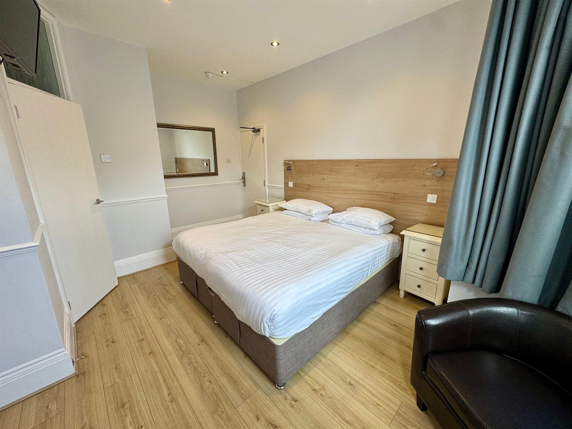 There is a large bed in the middle of the room.