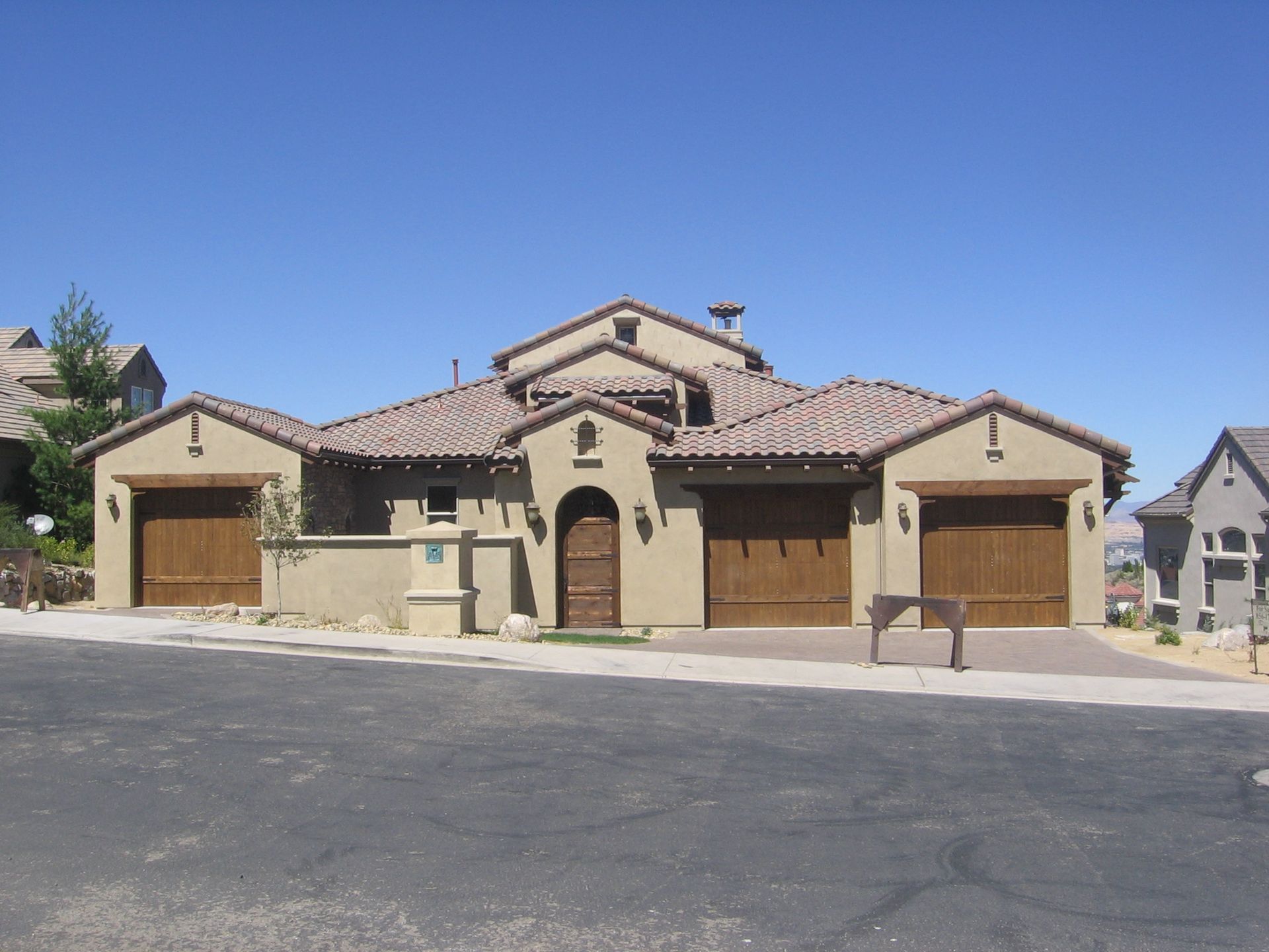A large house with a lot of garage doors
