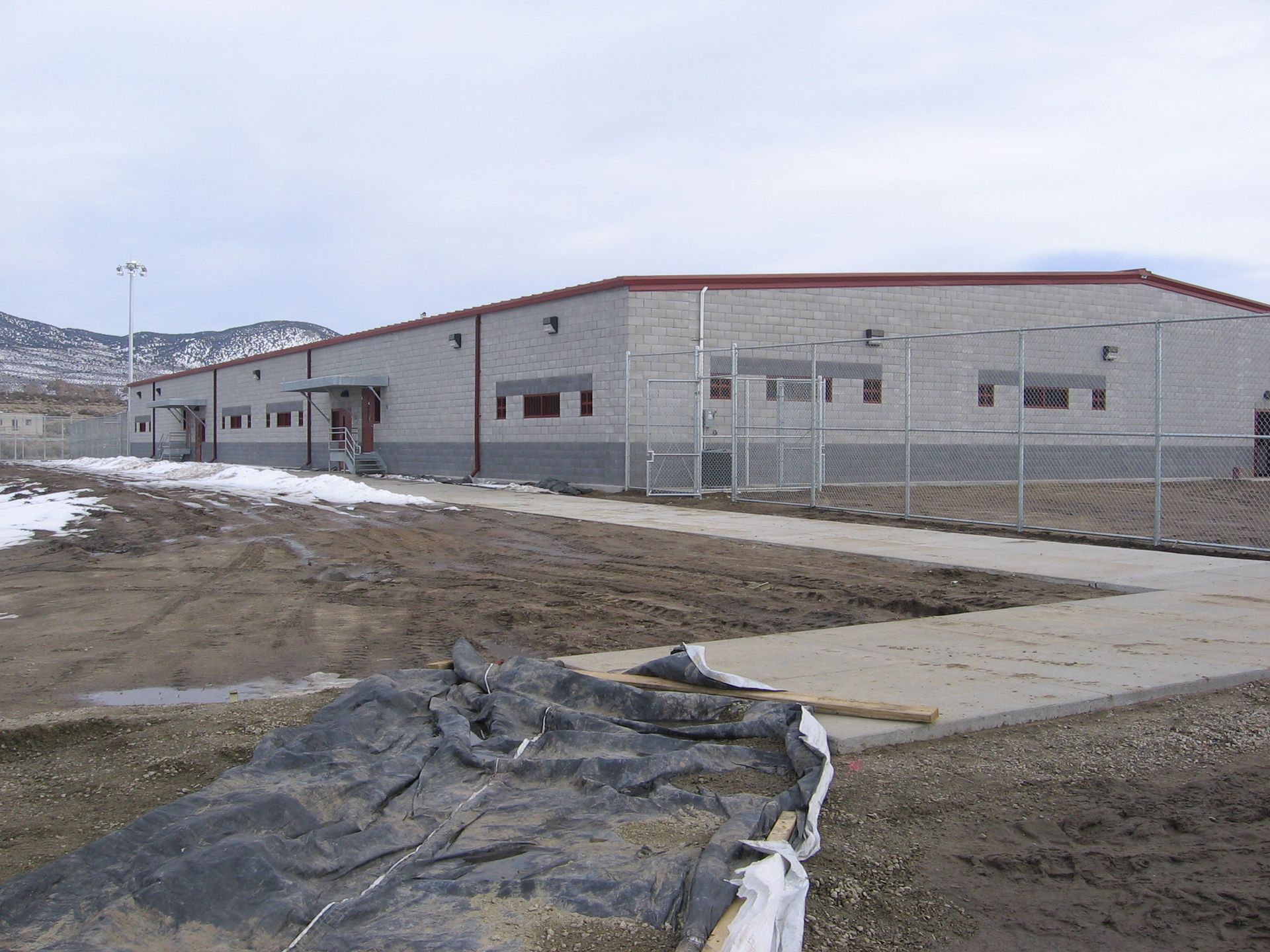 A building under construction with a fence around it
