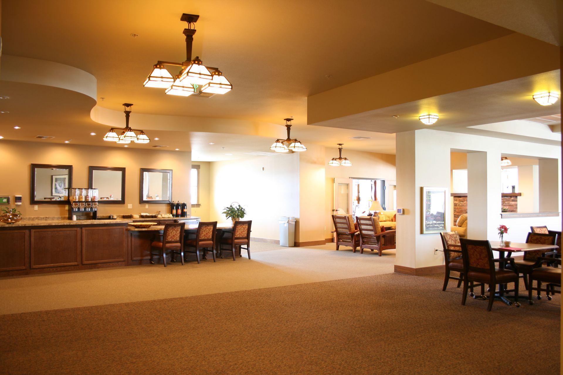 A large room with tables and chairs in it