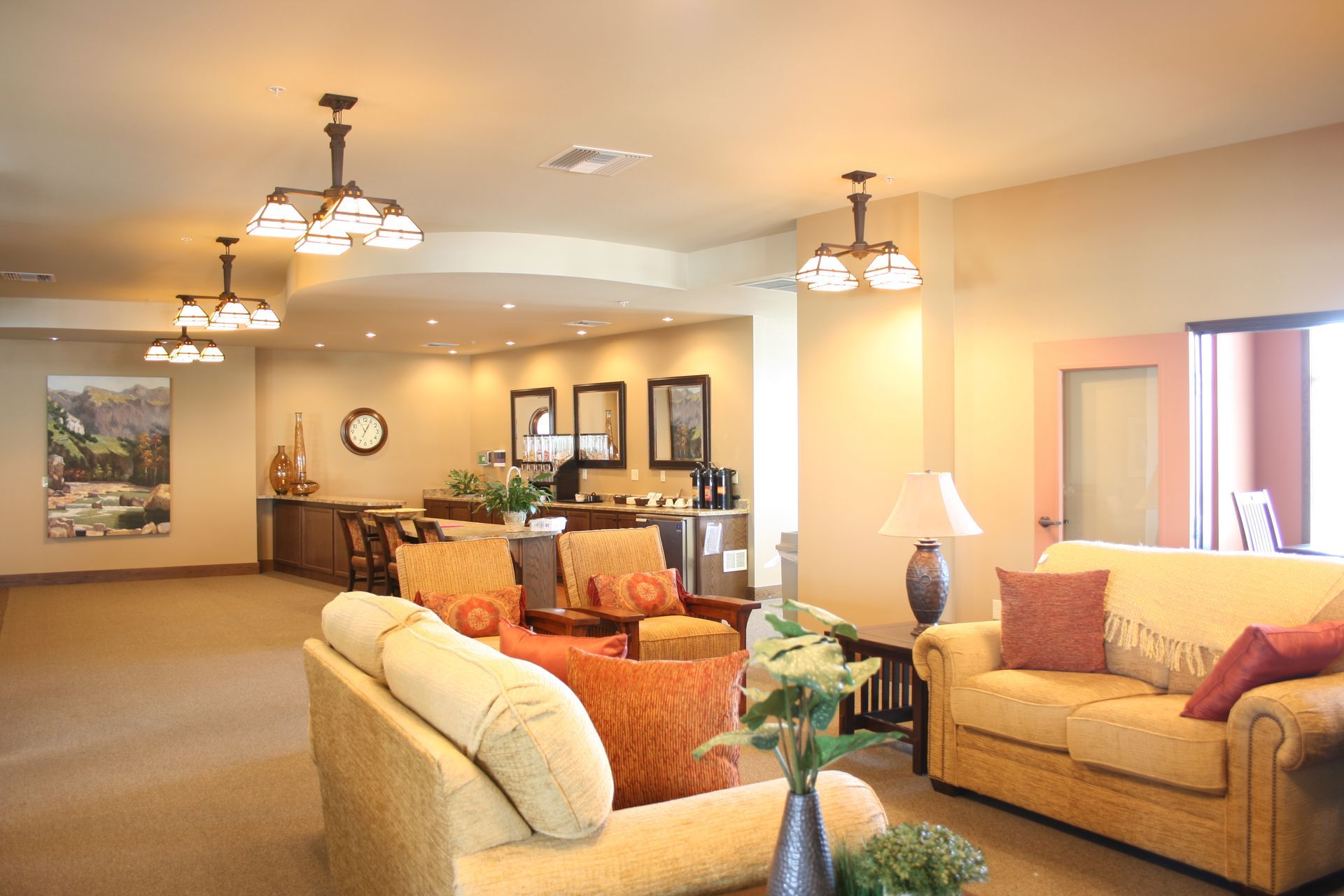 A living room with a couch and chairs in it