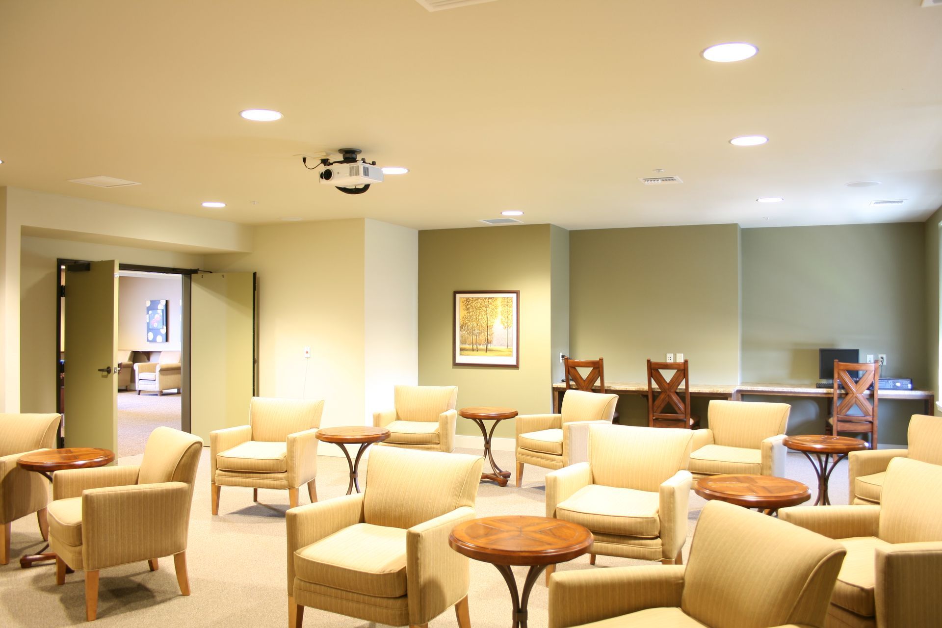 A large room with lots of chairs and tables