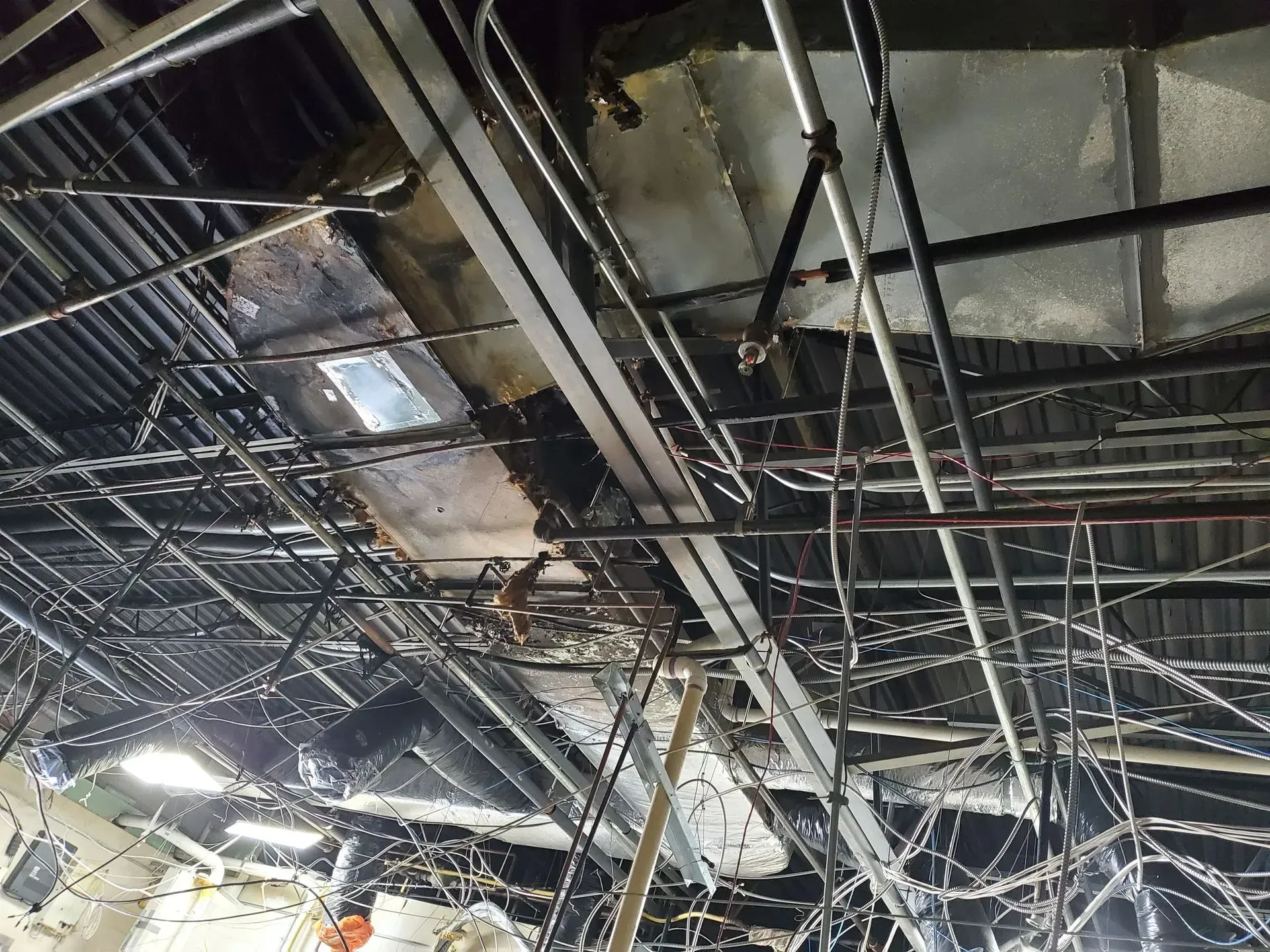 A ceiling with a lot of wires hanging from it
