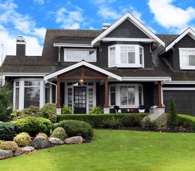 Routine lawn maintenance in a suburban front yard