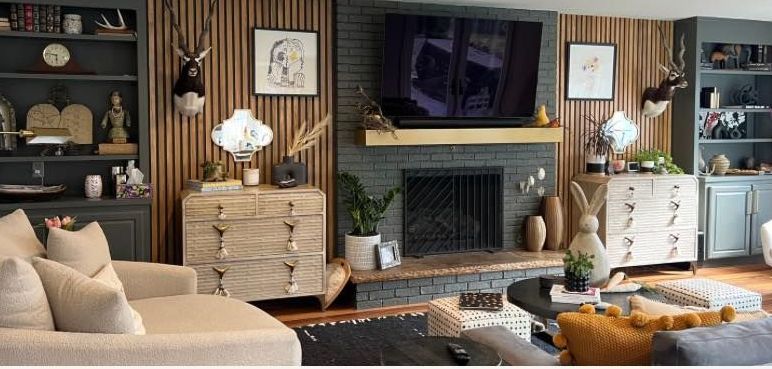 A living room with a fireplace and a flat screen tv.