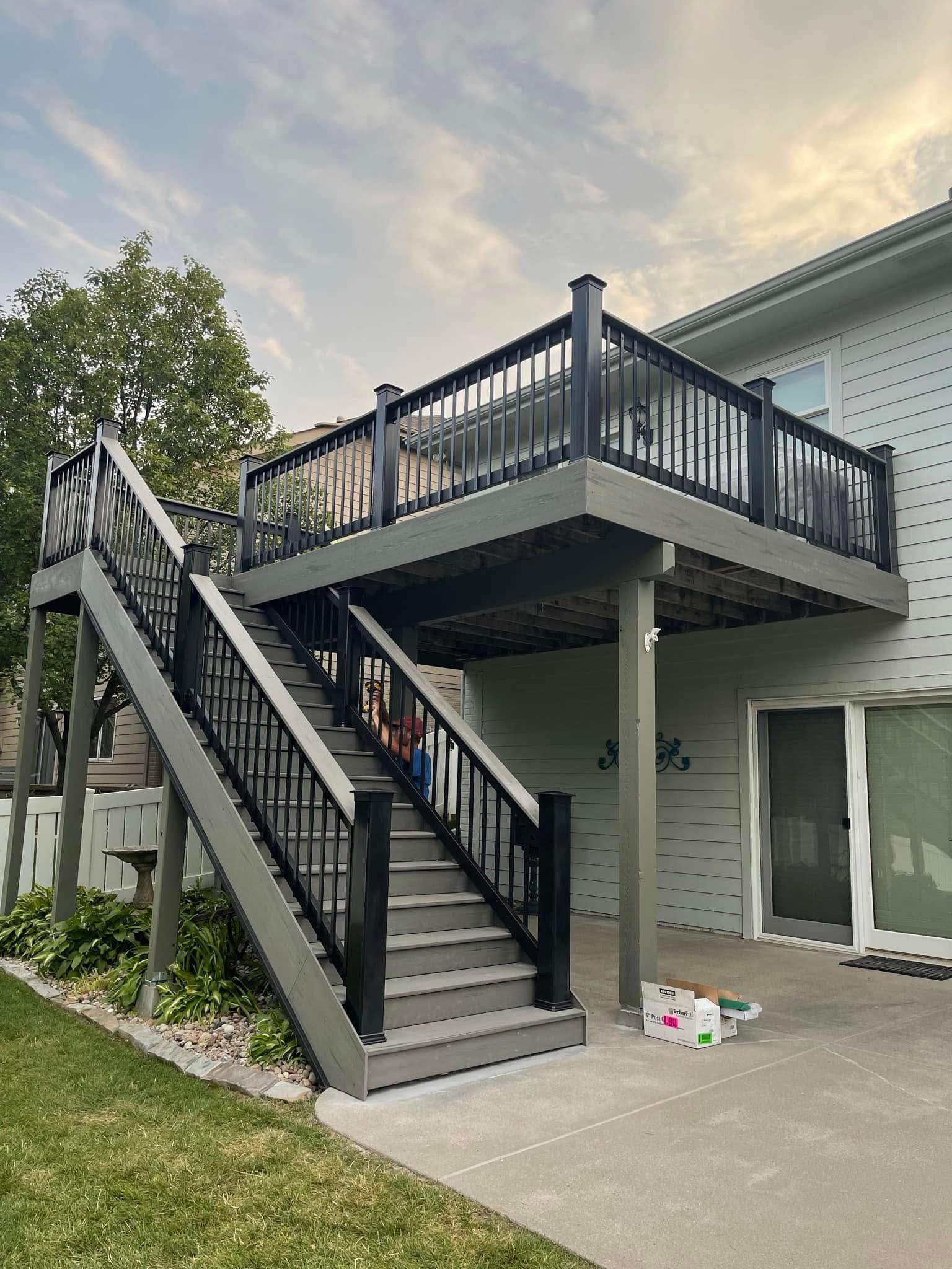 There is a deck with stairs leading up to it.