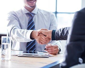 Business Man Shaking Hands — Insurance Service in Greeley, CO