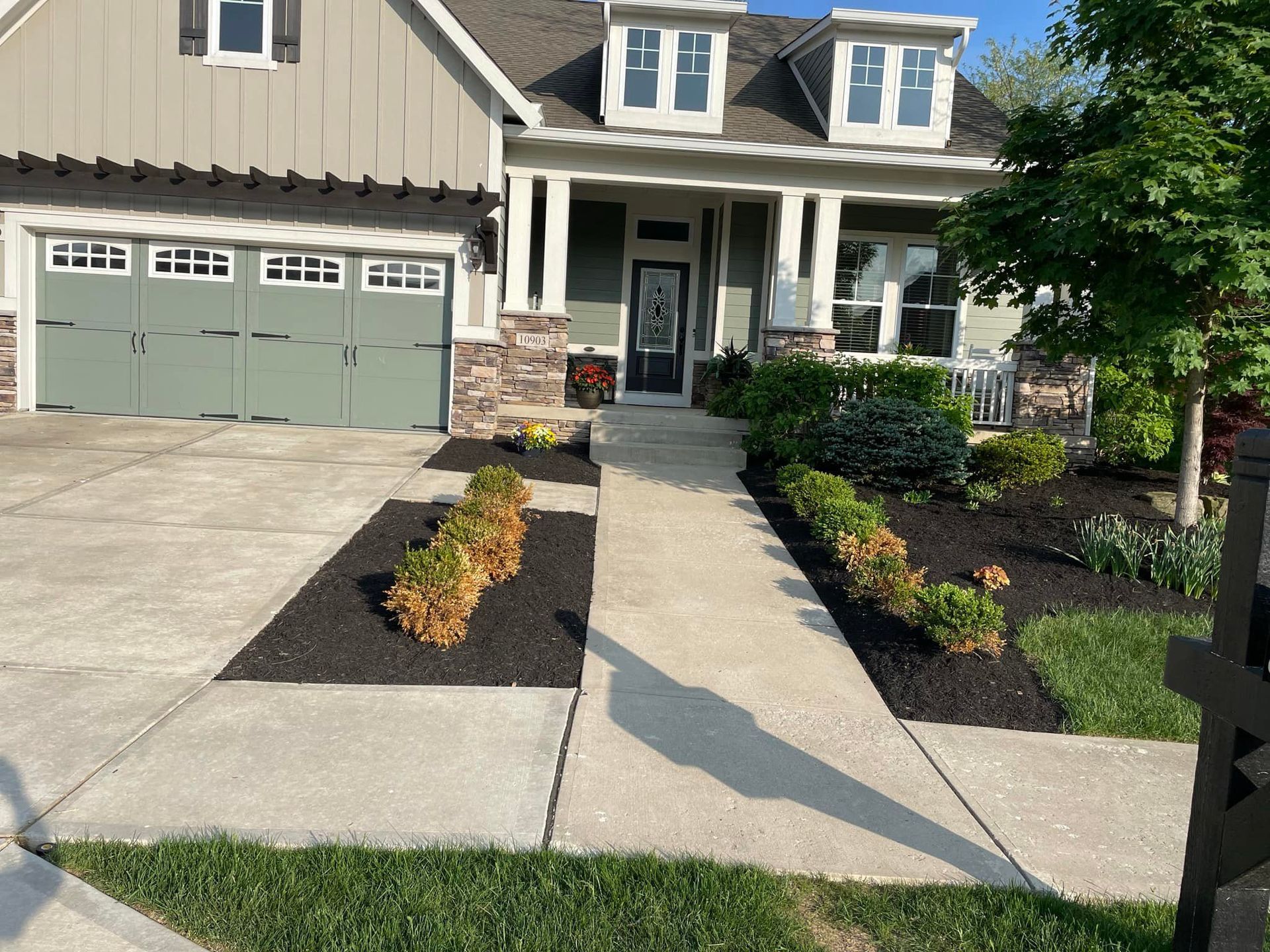 A house with a concrete walkway leading to it
