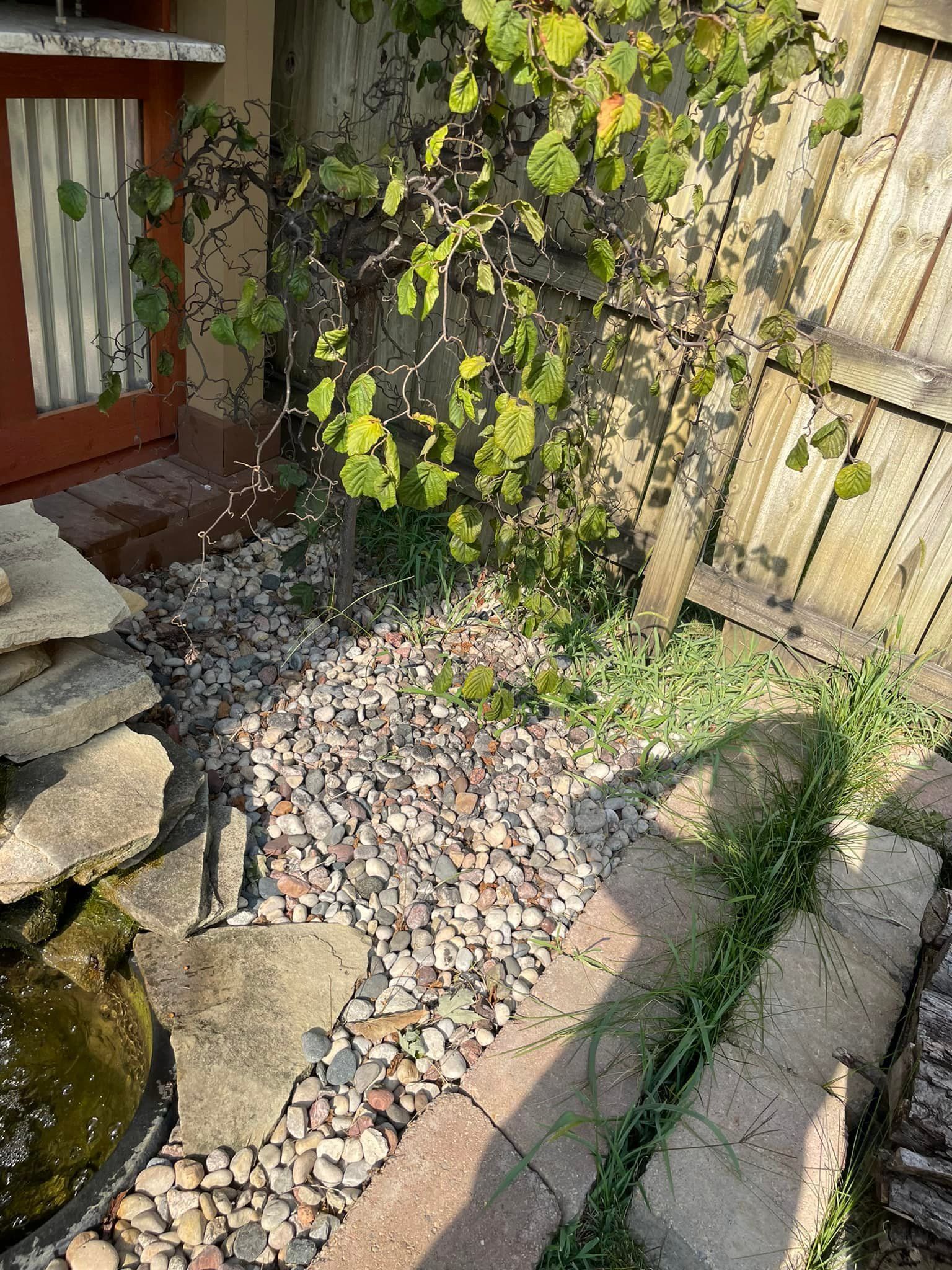 There is a fountain in the middle of the garden.