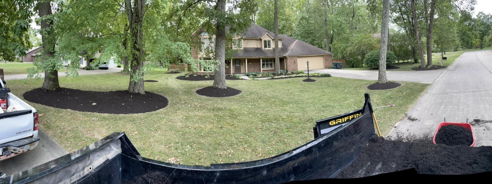 A truck is parked in front of a house in a residential area.