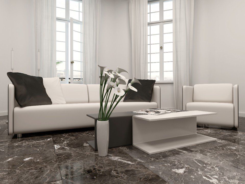 salotto con pavimento in marmo nero con venature bianche