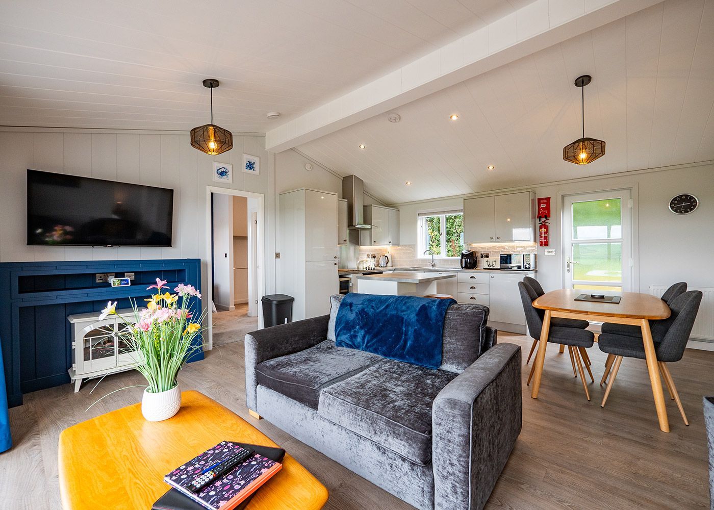 A living room with a couch , table and television.