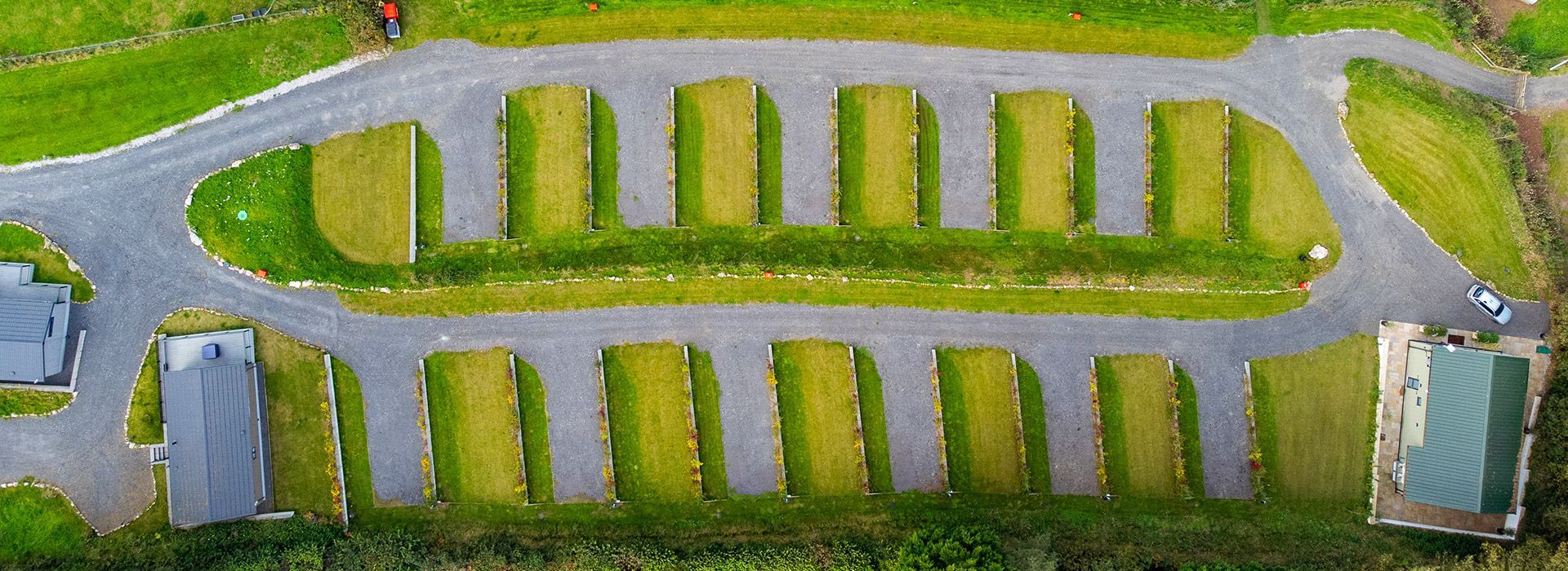 An aerial view of a park with a lot of grass and trees.