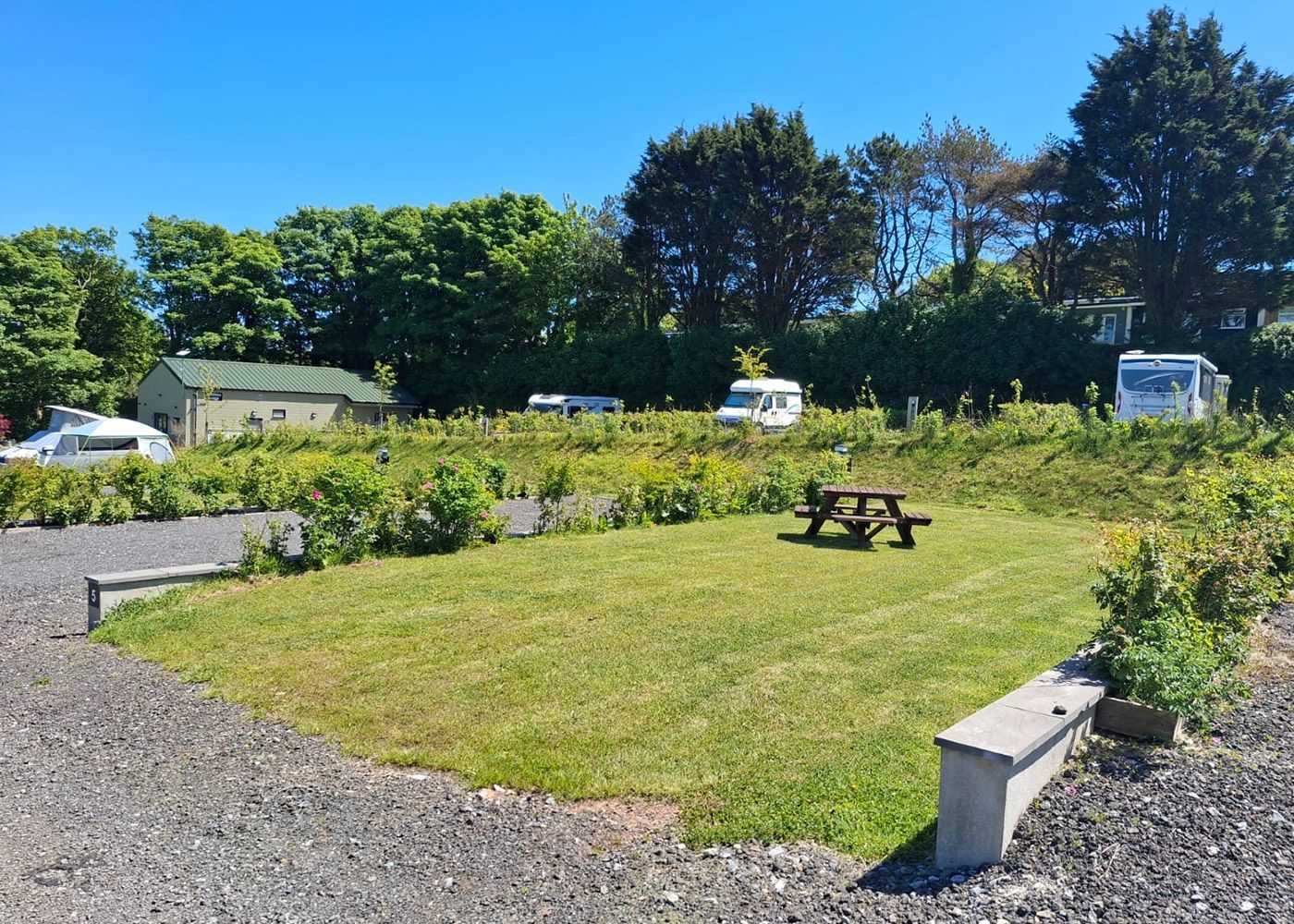 An aerial view of a parking lot in a grassy field.