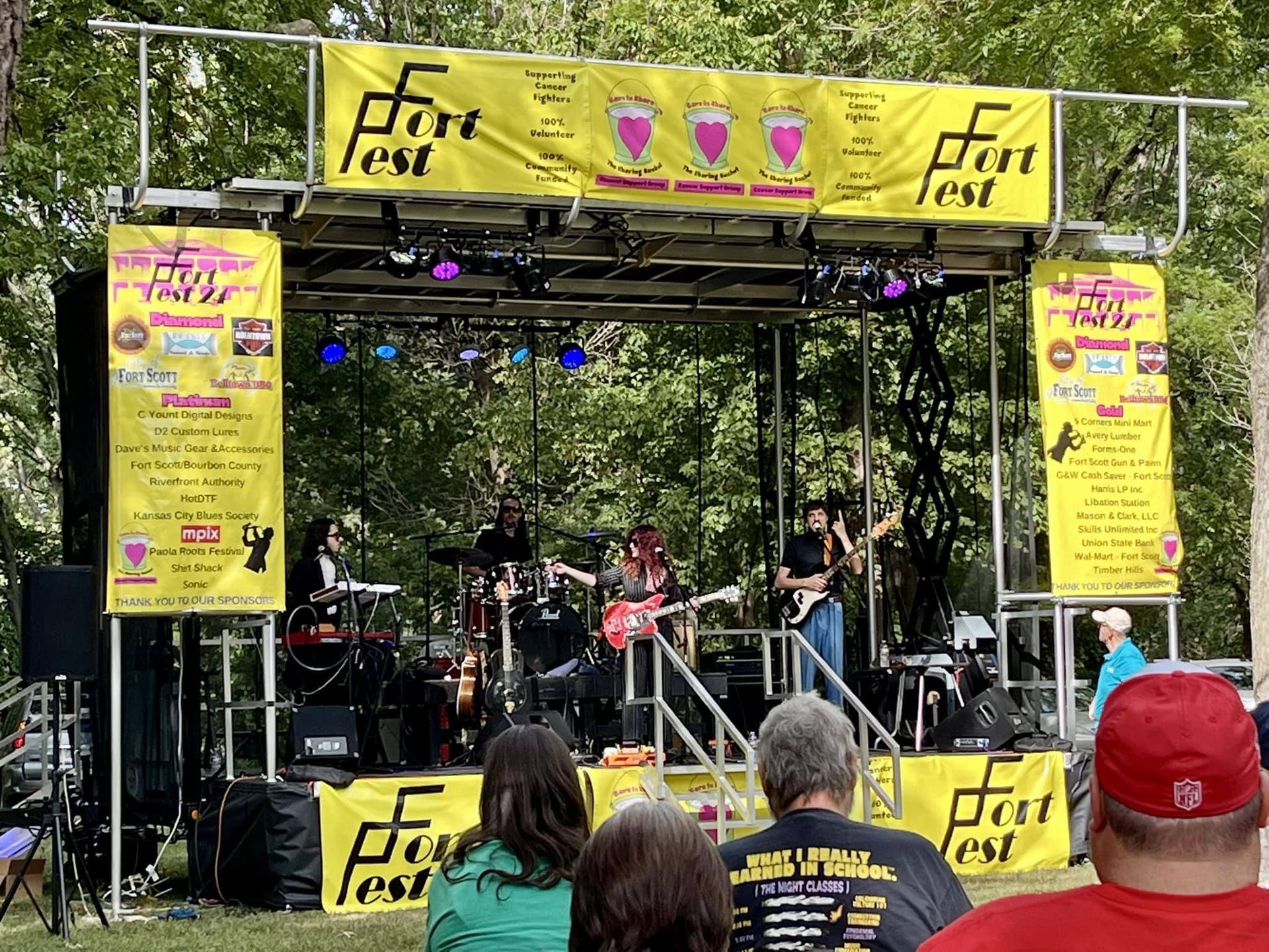 A band is playing on a stage at a fort fest