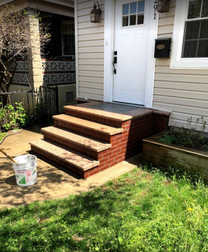 A house with brick steps and a white door