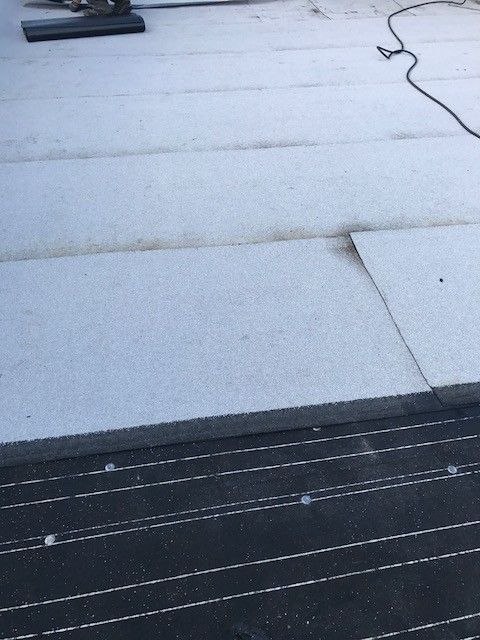 A roof with a few pieces of foam on it