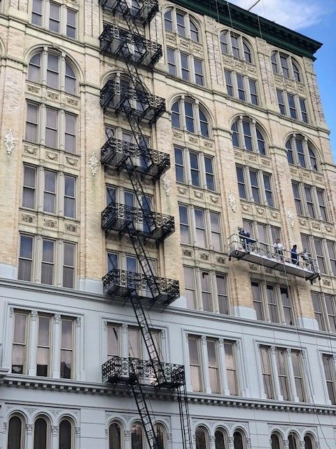 A large building with a fire escape on the side of it.