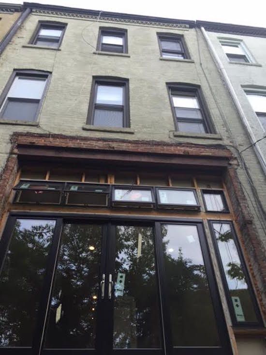 Looking up at a building with a lot of windows