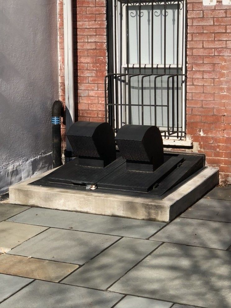 A brick building with a door that has the number 35 on it