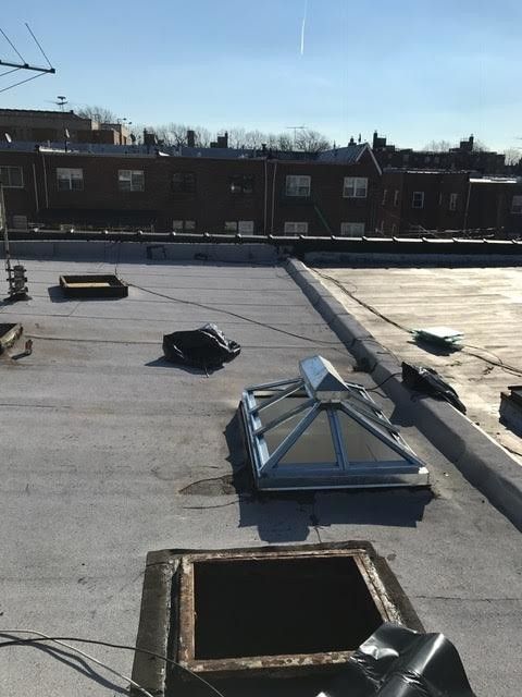The roof of a building with a skylight on it