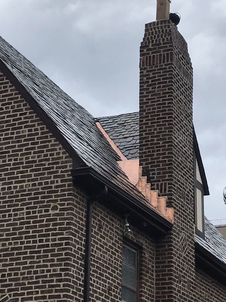 A brick building with a chimney on top of it