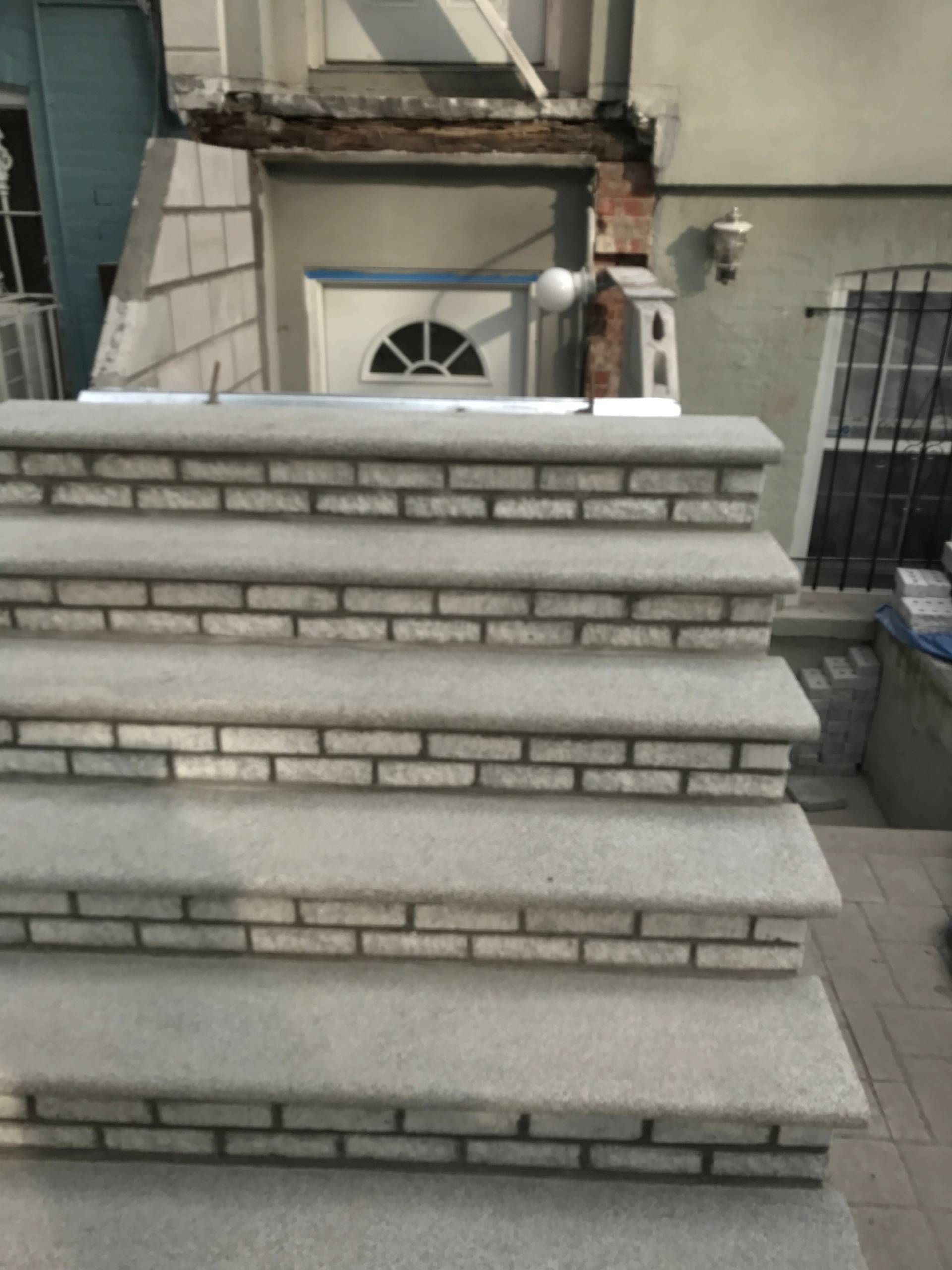 A set of brick stairs leading up to a building