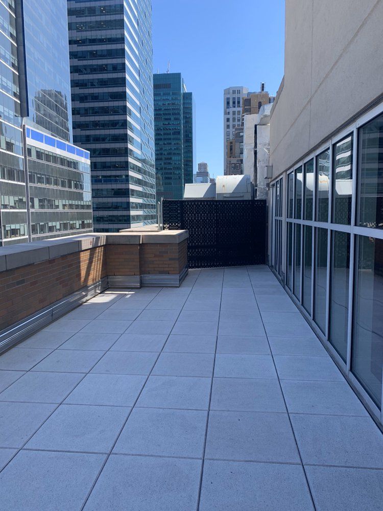 A rooftop deck with a view of the city skyline