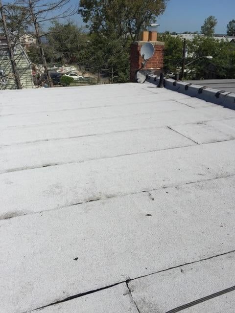 A white roof with a satellite dish on it