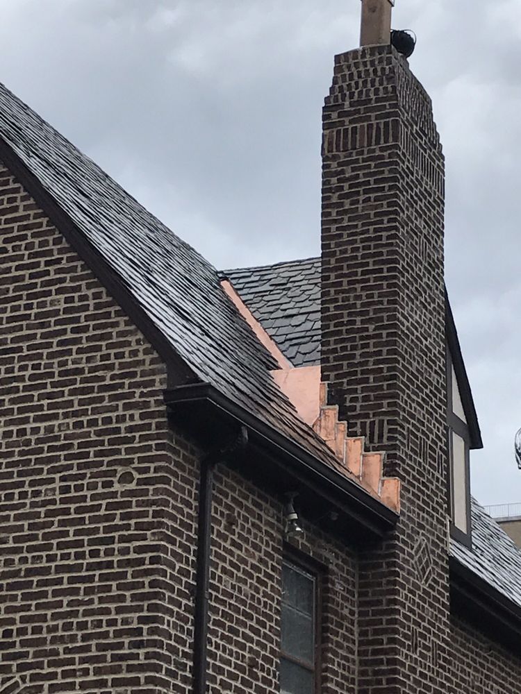 A brick building with a chimney on top of it