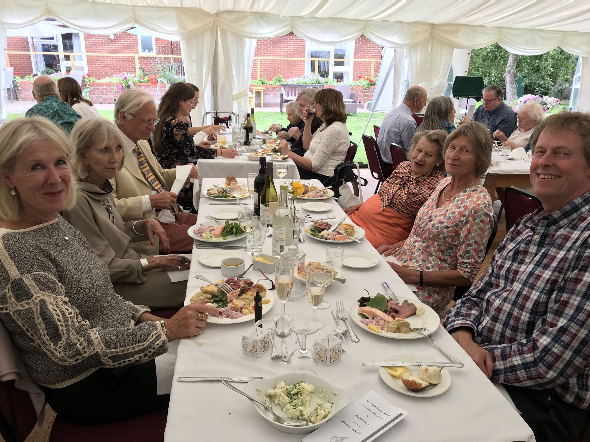 Group of seniors eating at a table