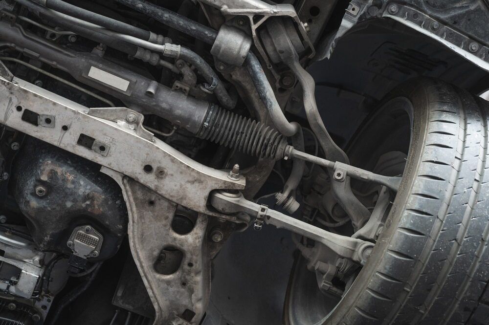 A Close Up of the Underside of a Car With a Tire — Powerhouse Auto Repairs Bundaberg in Bundaberg East, QLD
