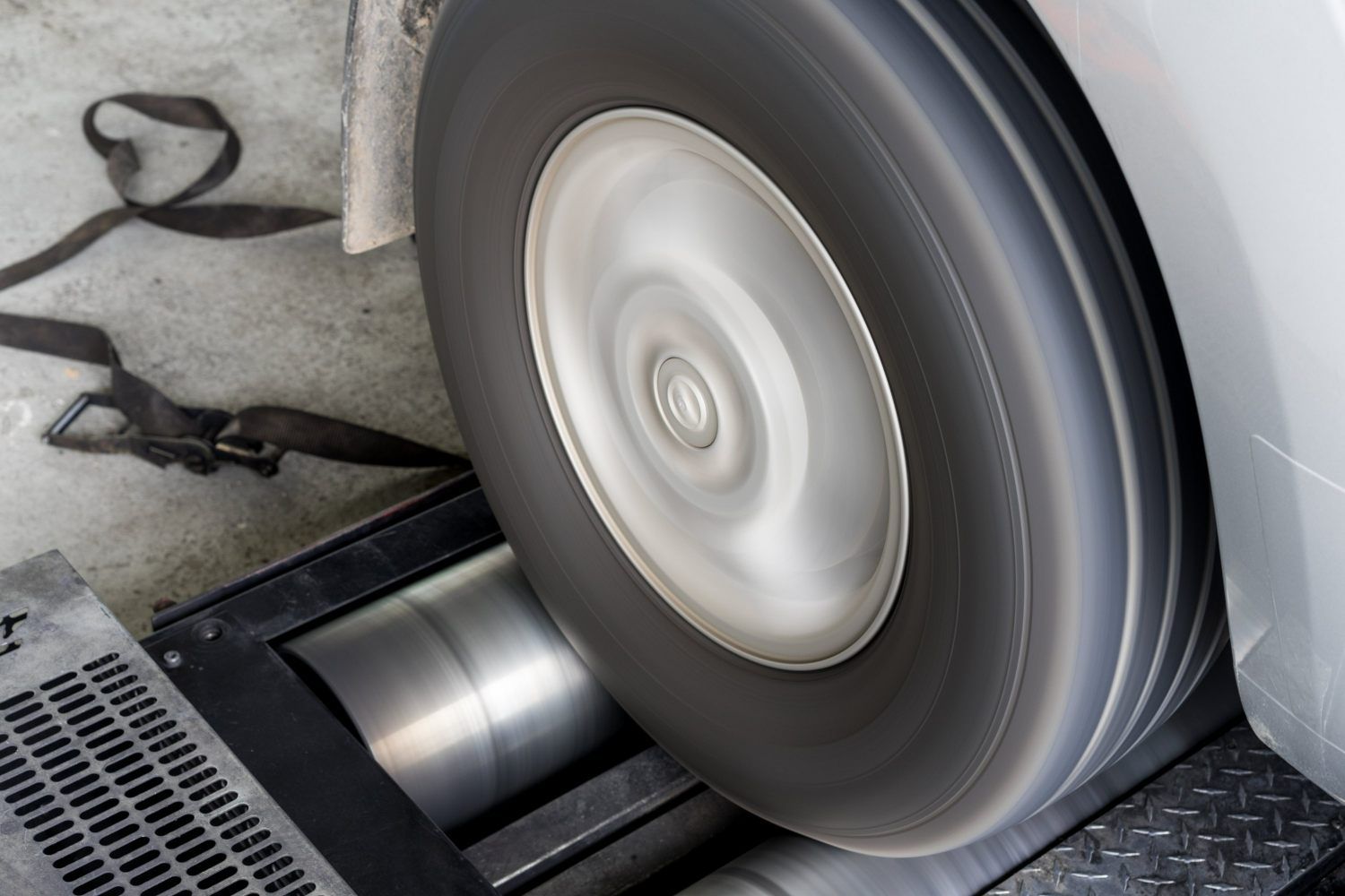 A Car Wheel is Being Tested on a Machine — Powerhouse Auto Repairs Bundaberg in Bundaberg East, QLD