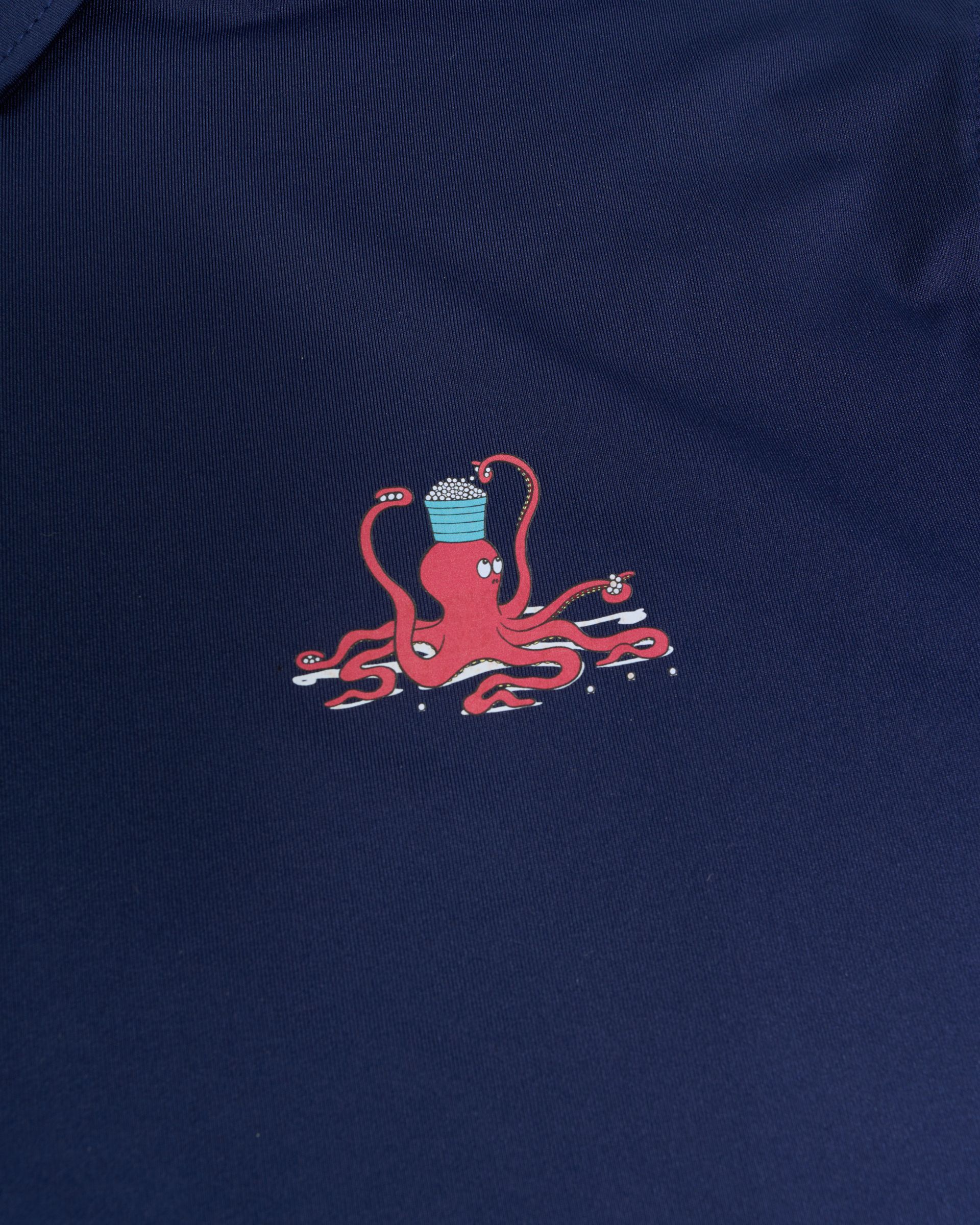 Golfer Guild Kraken Caddie polo featuring golfing animal octopus art by Jonas Claesson.