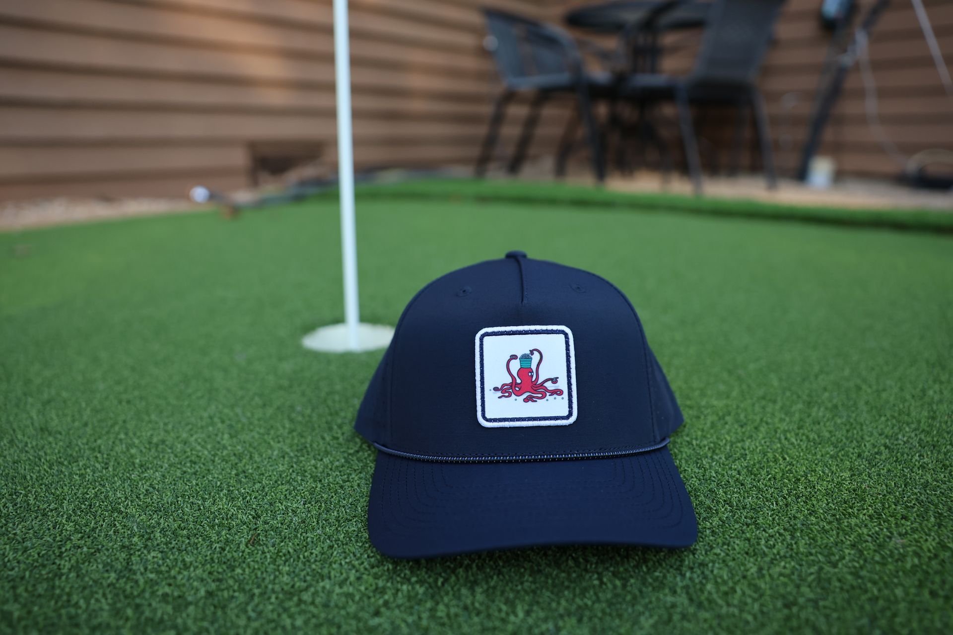 Golfer Guild Kraken Caddie Rope Hat with golfing animal octopus art by Jonas Claesson