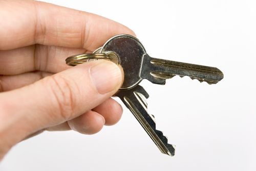 A Person Is Holding A Bunch Of Keys In Their Hand - Bolingbrook, IL - Master Locksmithing Inc